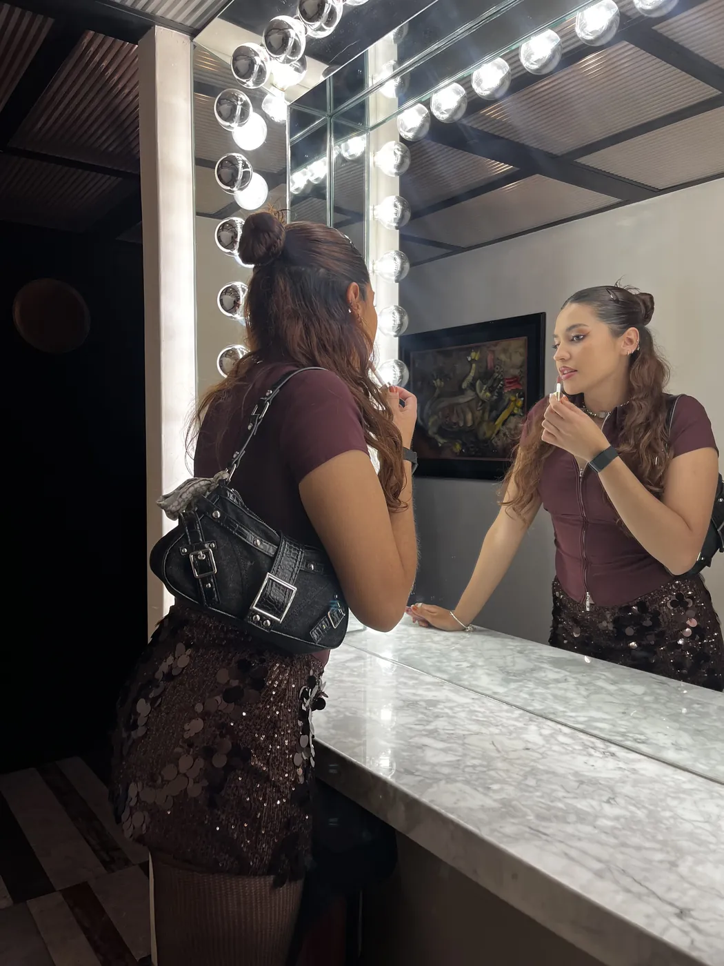 Pily doing her makeup